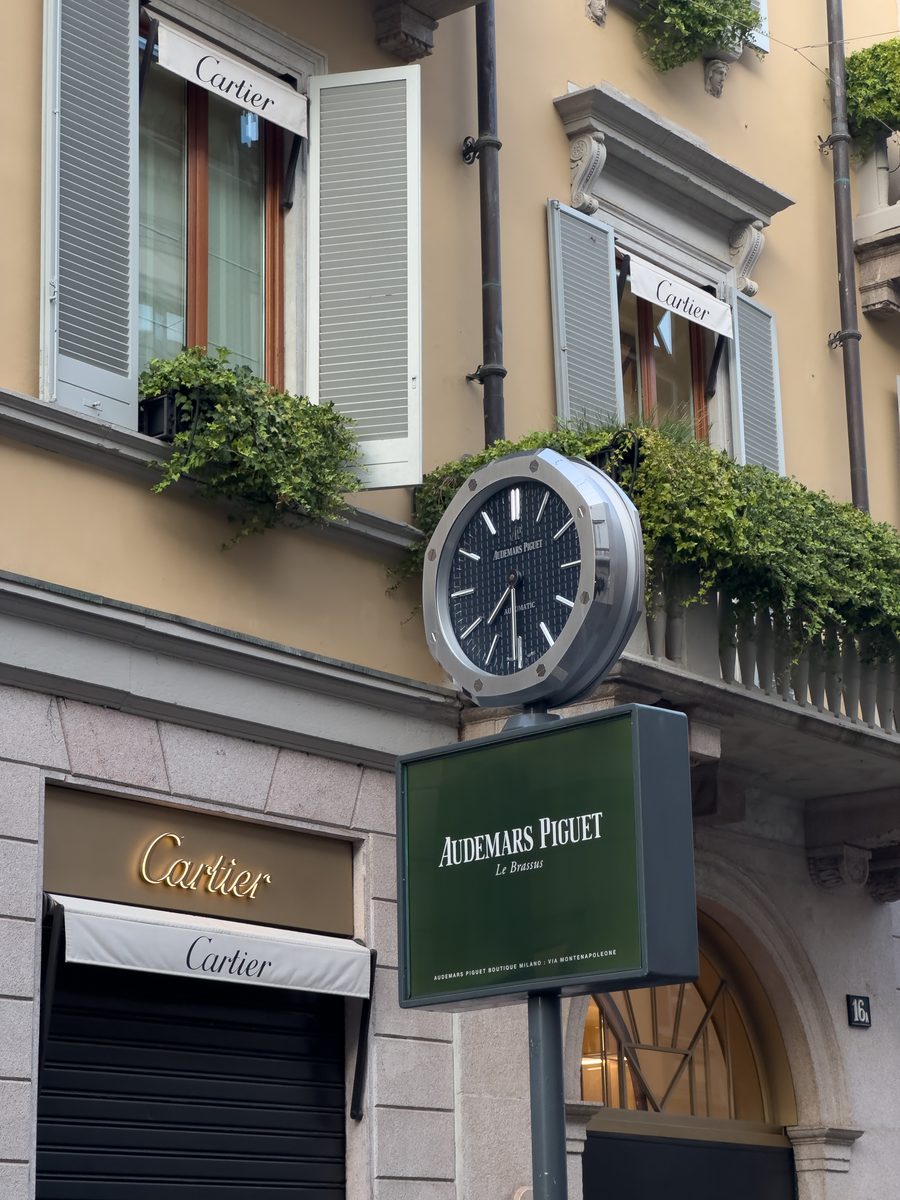 Street clock and boutique facades — original